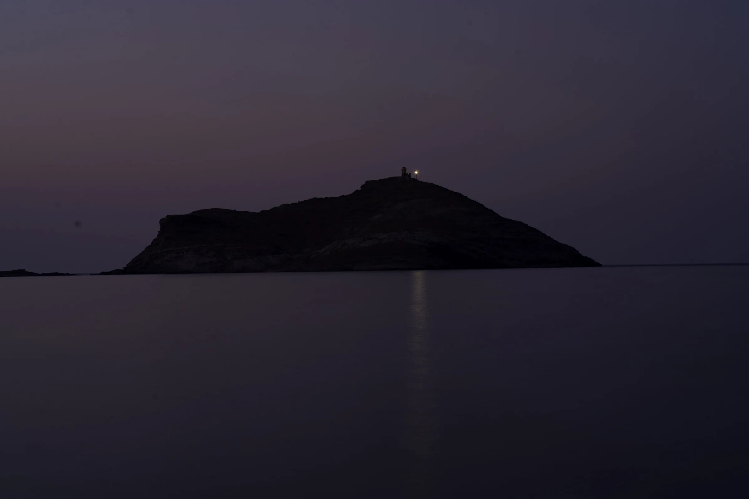 Islet at dusk · Tinos