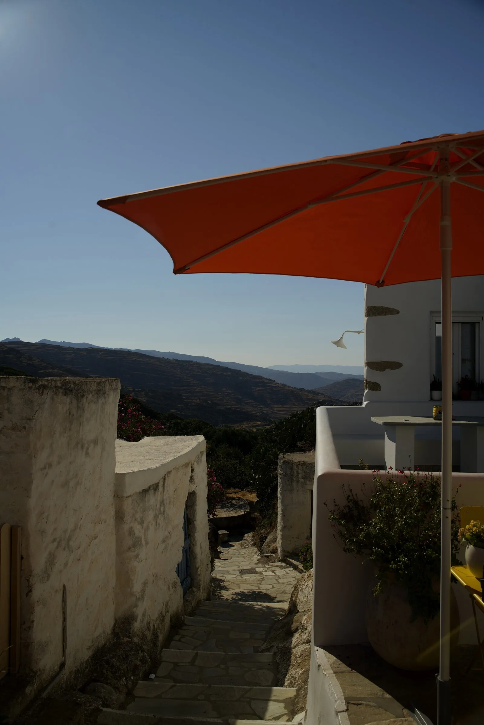 Orange umbrella · Tinos